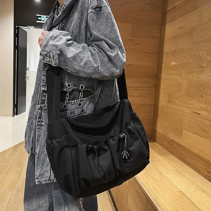 Fashionable Crossbody Bag Drawstring Accent - Spacious Secure Zipper Closure Includes Stylish Charm