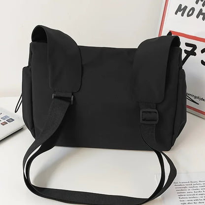 Fashionable Crossbody Bag Drawstring Accent - Spacious Secure Zipper Closure Includes Stylish Charm