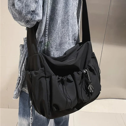 Fashionable Crossbody Bag Drawstring Accent - Spacious Secure Zipper Closure Includes Stylish Charm